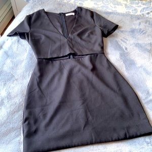 Short dress with slit across waist. Very cute. Zipper down the back.